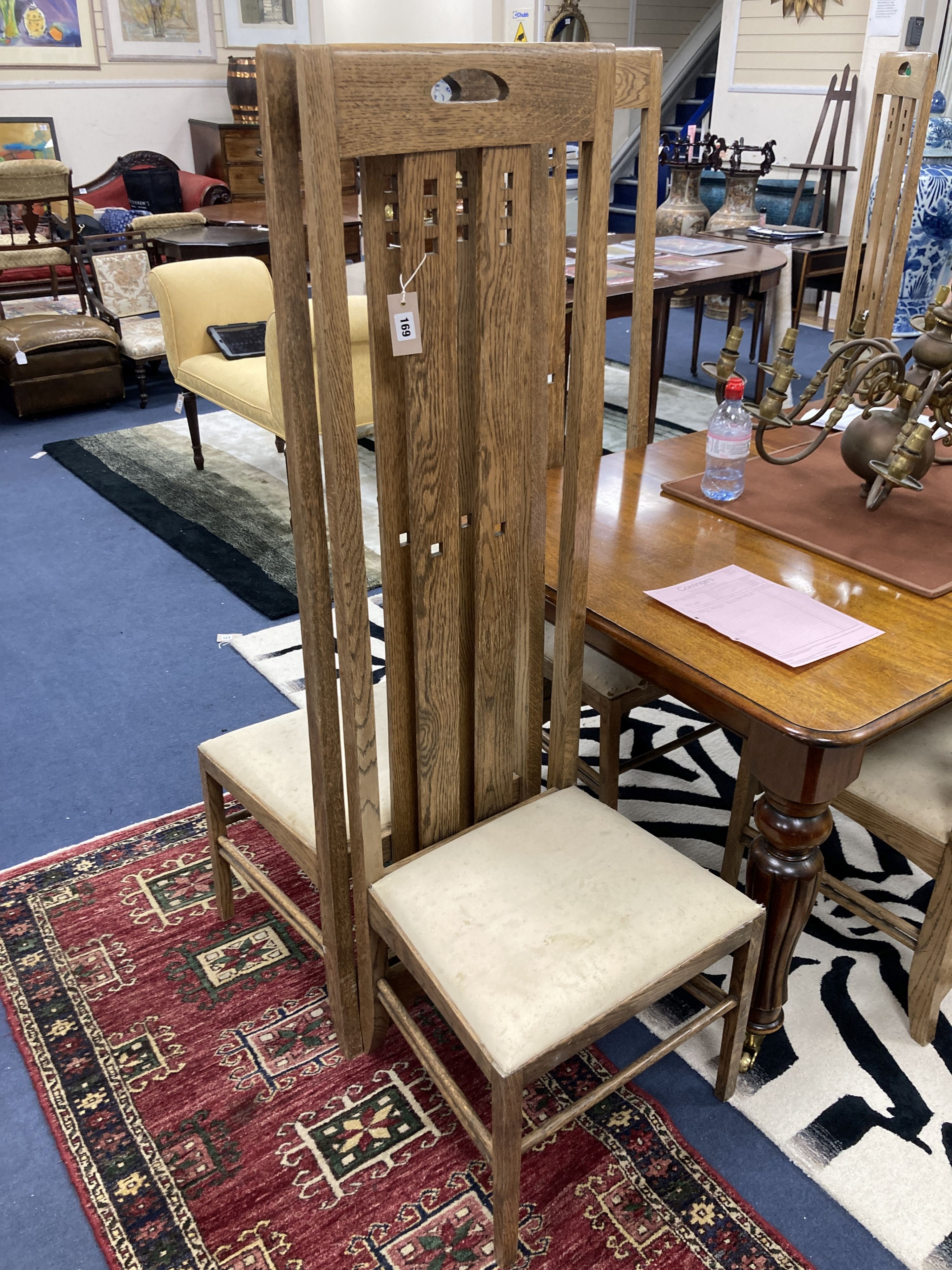 A set of six Macintosh style oak high back dining chairs. H-151cm.